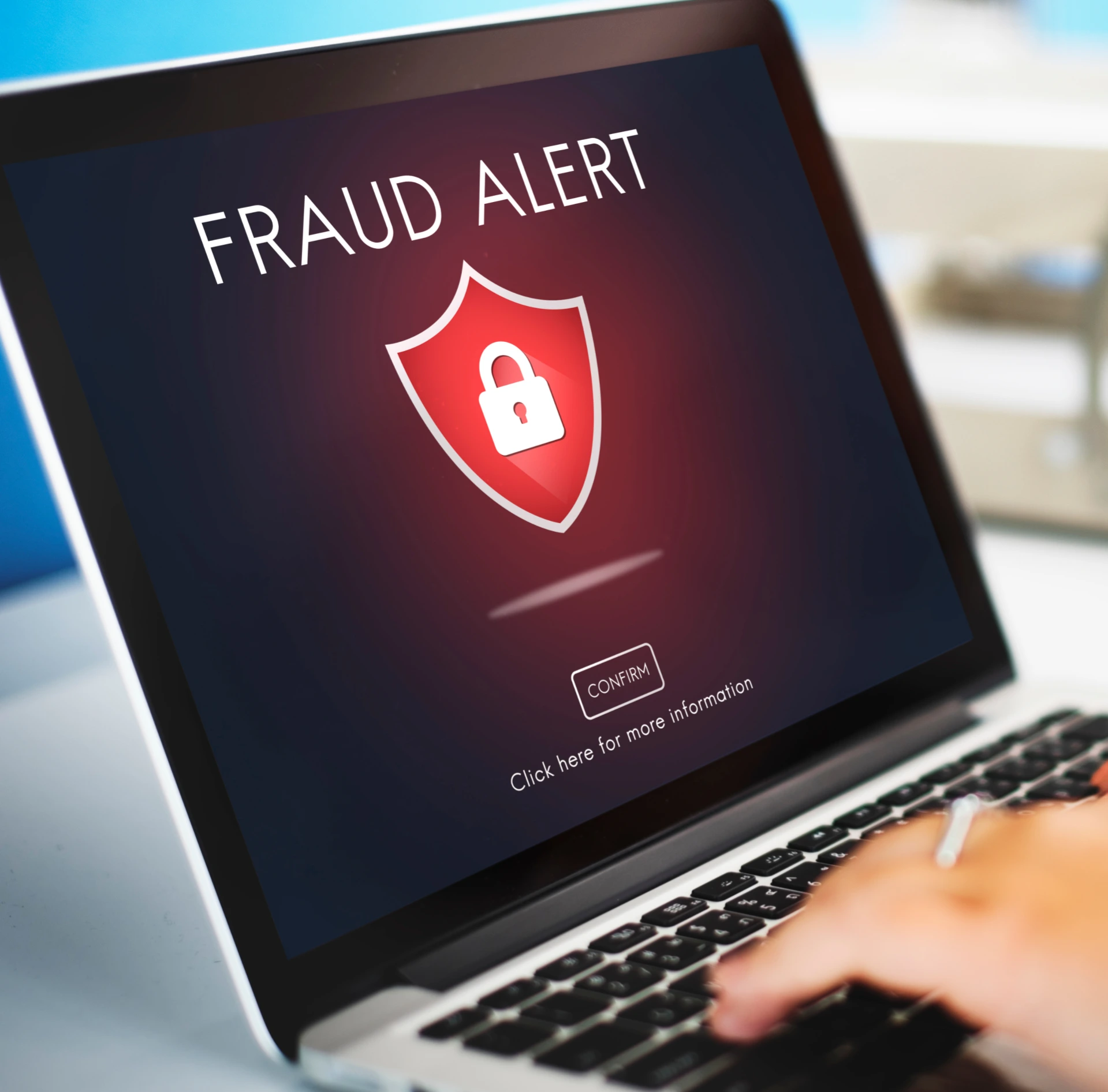 Person typing on a laptop keyboard