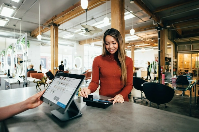 customer making a credit card payment at the counter